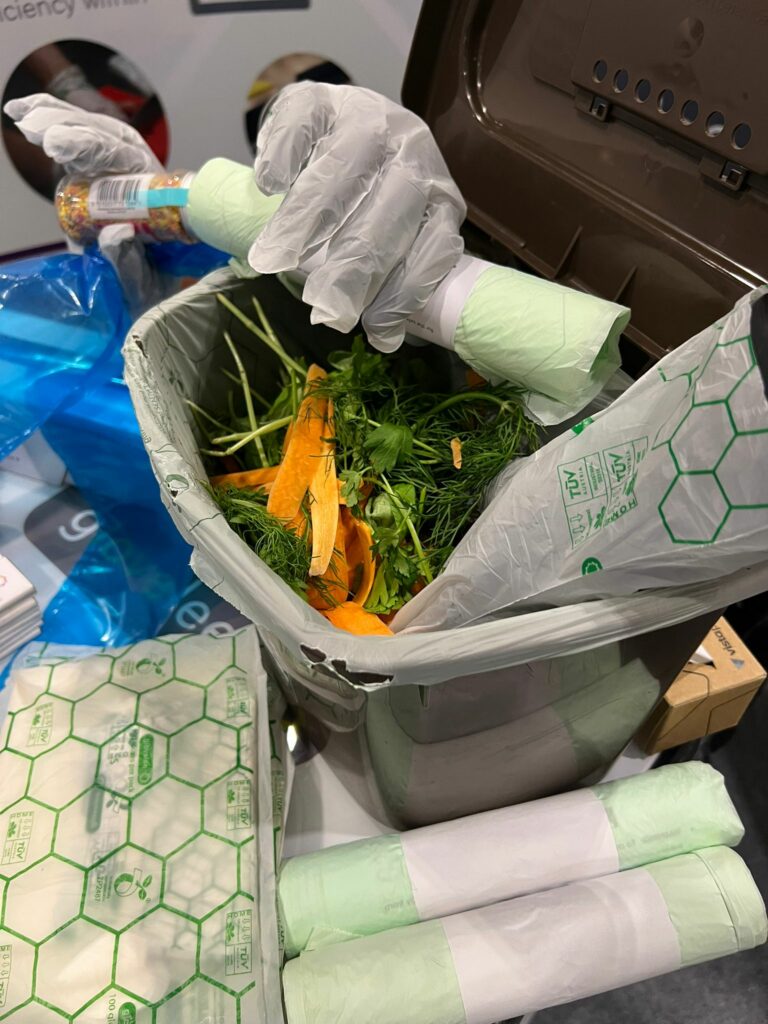 Compostable bags and gloves displayed at the event